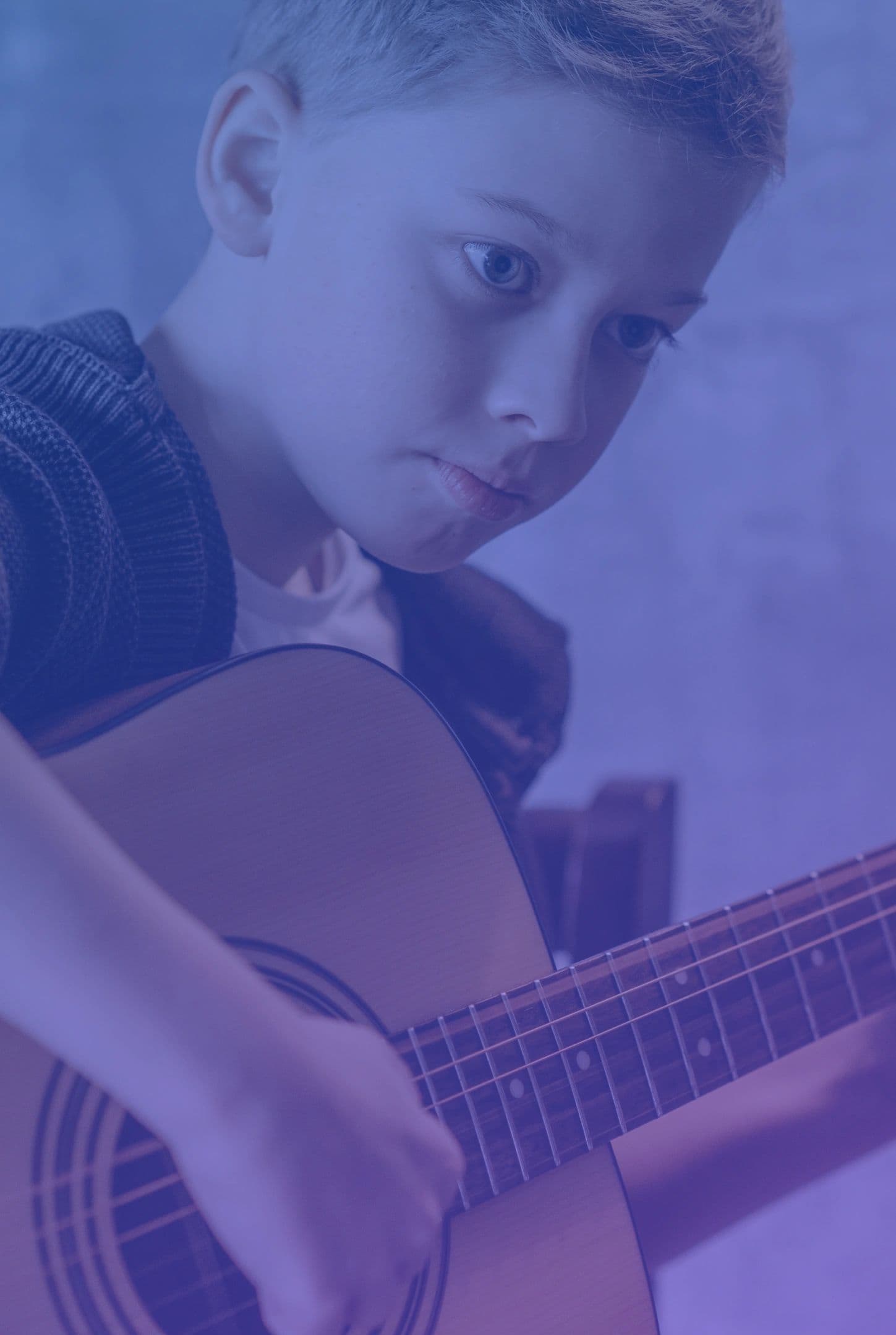 Young musician playing guitar