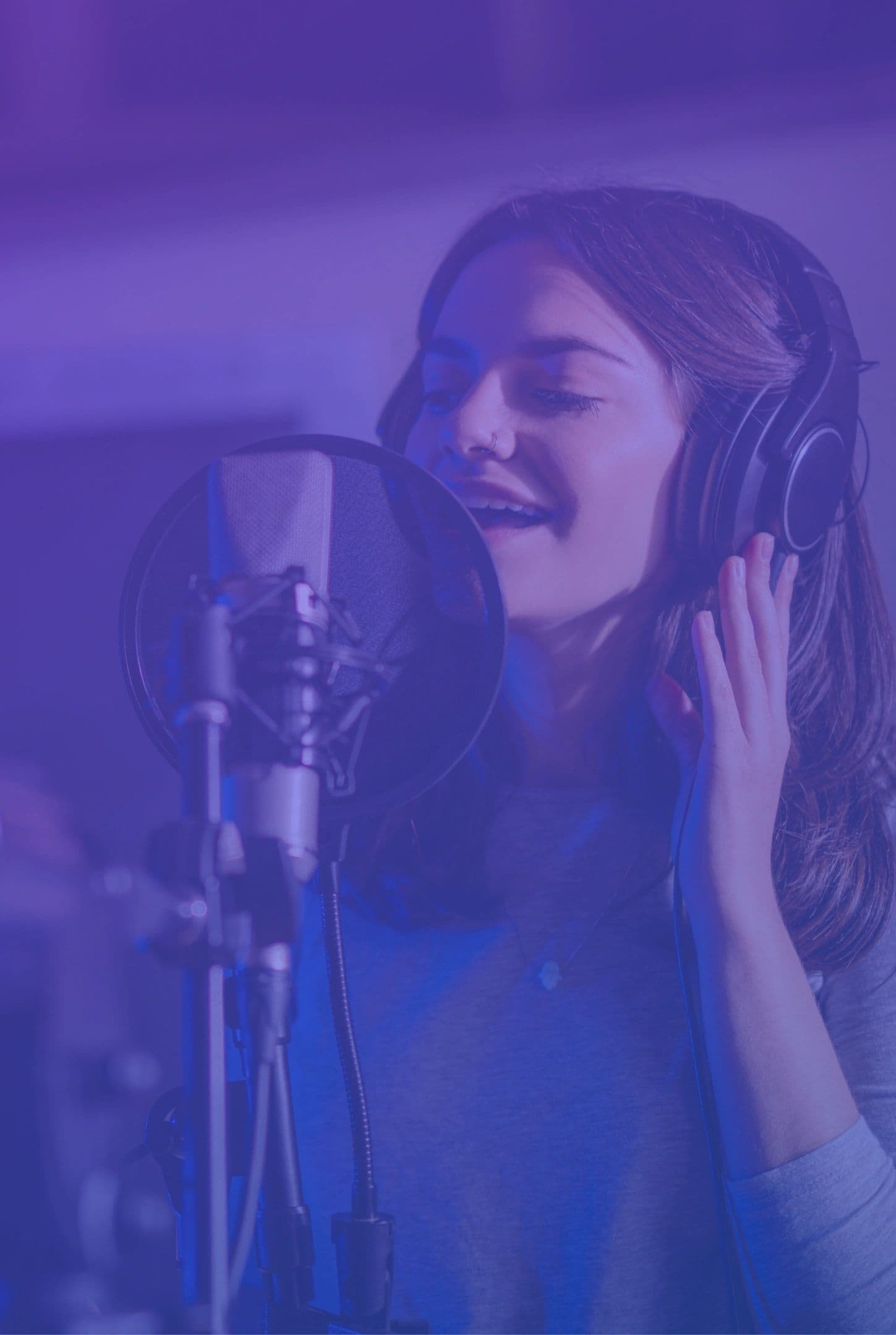 Singer practicing at a microphone